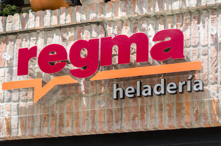 SANTANDER, SPAIN - JULY 11, 2021: Logo of the Regma ice cream shop in one of its stores in Santander, Spain. Regma ice cream shop, founded in Santander in 1933, is famous in northern Spainのeditorial素材