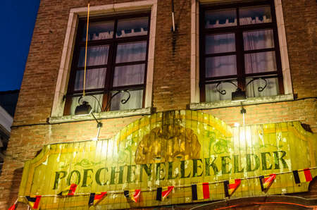 BRUSSELS, BELGIUM - AUGUST 21, 2013: The facade of a typical Belgian pub called Poechenellekelder in Brussels, Belgiumのeditorial素材