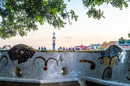 BARCELONA, SPAIN - DECEMBER 8, 2013: Tourists visiting the famous Park Guell in Barcelona,...