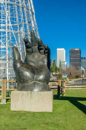 MADRID, SPAIN - JANUARY 12, 2022: "The Hand", a bronze sculpture by the Colombian sculptor Fernando Botero, bought by Telefonica in 1994. In April 1995 Telefonica loaned the sculpture to the city of Madrid, Spain and it was installed on Paseo de la Castelのeditorial素材