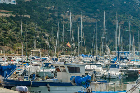 CALPE, SPAIN - JANUARY 26, 2022: View of the fishing port of Calpe, with the PeÃ±on de Ifach in...