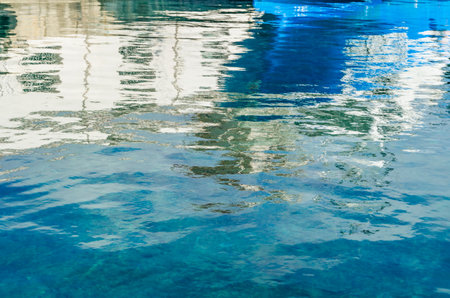 Water reflection of boats in the Mediterranean port of Calpe, Alicante province, Spainの写真素材