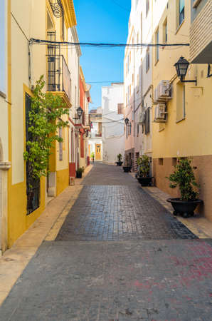 View of colorful buildings and narrow streets, architecture in the historic center of the Mediterranean town of Calpe, Alicante province, Valencian Community, Spainの写真素材