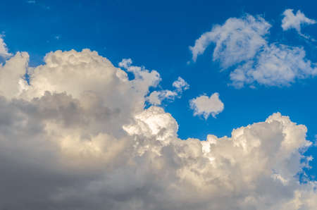 Beautiful colorful clouds over blue sky backgroundの写真素材