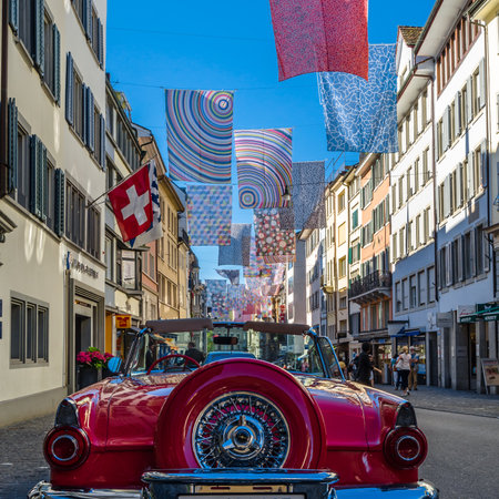 ZURICH, SWITZERLAND - SEPTEMBER 3, 2013: Shopping street in Zurich, Switzerland, decorated with multicolored bannersのeditorial素材