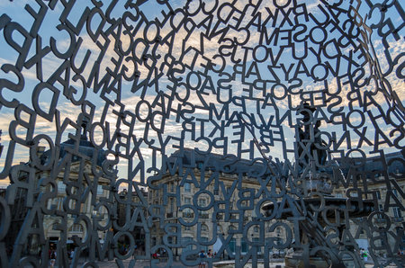 BORDEAUX, FRANCE- AUGUST 16, 2013: Detail of the modern sculpture "House of Knowledge" made by the Spanish artist Jaume Plensa in 2008, a structure in stainless steel, temporarily exhibited in the Place de la Bourse in Bordeaux, France, between 27 June anのeditorial素材