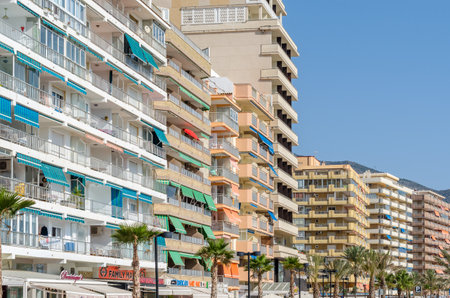 FUENGIROLA, SPAIN - OCTOBER 13, 2021: Buildings overlooking the beach on the seafront in Fuengirola, Andalusia, southern Spainのeditorial素材