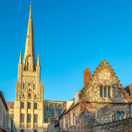 The Anglican cathedral in Norwich Norfolk, UK, dedicated to the Holy and Undivided Trinity. The construction began in 1096 and was completed in 1145, built out of flint and mortar and faced with a cream-coloured Caen limestoneの写真素材