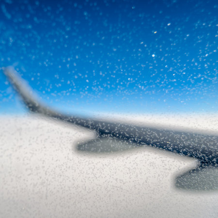 Ice crystals on the window of an airplane in flightの写真素材