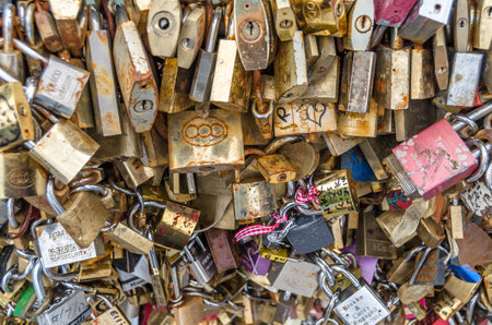 PARIS, FRANCE - JULY 5, 2014: Detail of padlocks as a symbol of love, which decorate a famous bridge...