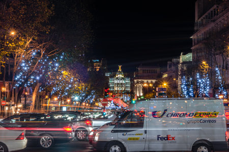 MADRID, SPAIN - DECEMBER 20, 2013: Night view of Madrid streets, with a lot of traffic and cars waiting at the traffic lightのeditorial素材