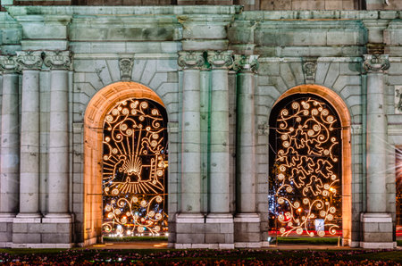 The Puerta de Alcala, monument in Madrid, Spain, decorated with Christmas lights