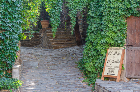 PATONES DE ARRIBA, SPAIN - AUGUST 24, 2019: Sign indicating a restaurant in Patones de Arriba...