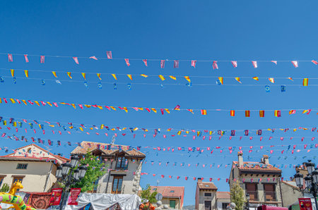 RASCAFRIA, SPAIN - AUGUST 17, 2019: View of the streets in the village of Rascafria, Spain, decorated during its local feastsのeditorial素材