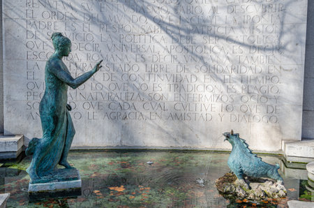 MADRID, SPAIN - FEBRUARY 23, 2014: The Monument to Eugenio d'Ors Rovira in Madrid, Spain. Dedicated to Eugenio d'Ors, a Catalan writer, it consists of a sculptural group put inside a fountain, created by VÃ­ctor d'Ors, son of Eugenio, in 1963のeditorial素材