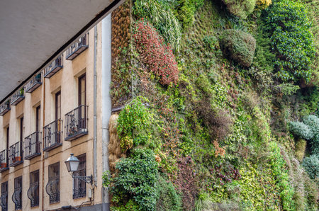 MADRID, SPAIN - MARCH 1, 2014: The CaixaForum cultural center in Madrid, Spain, accompanied by a vertical garden, the work of French landscape designer Patrick Blancのeditorial素材