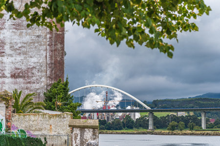 NAVIA, SPAIN - AUGUST 22, 2022: Ence power plant in Navia, Spain. Ence is a Spanish multinational company that develops and supplies technologies, automation systems and services for the paper and energy industriesのeditorial素材