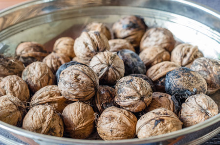Freshly picked walnuts in a bowl