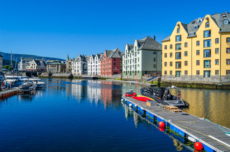 ALESUND, NORWAY - JULY 19, 2014: View of buildings reflected in water in Alesund, More og Romsdal County, Norway, city known for Art Nouveau architectureのeditorial素材