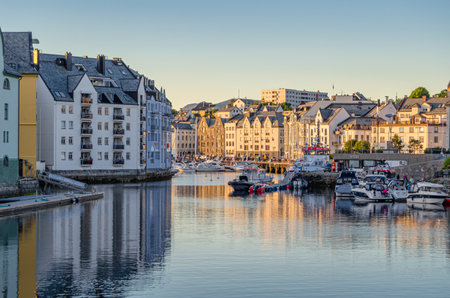 ALESUND, NORWAY - JULY 19, 2014: View of buildings reflected in water in Alesund, More og Romsdal County, Norway, city known for Art Nouveau architectureのeditorial素材
