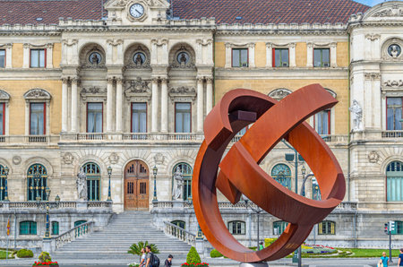 BILBAO, SPAIN - MAY 10, 2014: Sculpture "Ovoid Variant", work of the Basque sculptor Jorge Oteiza, created in 1958, made of weathering steel. The work was placed in 2002 in front of the Bilbao City Hall, Basque Country, Spainのeditorial素材