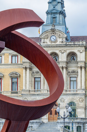 BILBAO, SPAIN - MAY 10, 2014: Sculpture "Ovoid Variant", work of the Basque sculptor Jorge Oteiza, created in 1958, made of weathering steel. The work was placed in 2002 in front of the Bilbao City Hall, Basque Country, Spainのeditorial素材