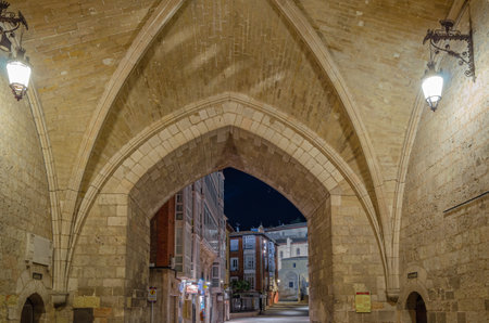 Night view of the old town of Burgos, Castile and Leon, Spain, from the Arch of Saint Mary, one of the ancient gateways to the city in the Middle Agesの写真素材
