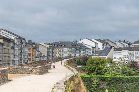 LUGO, SPAIN - AUGUST 26, 2022: View of the old town of Lugo, from the Roman walls, Galicia,...