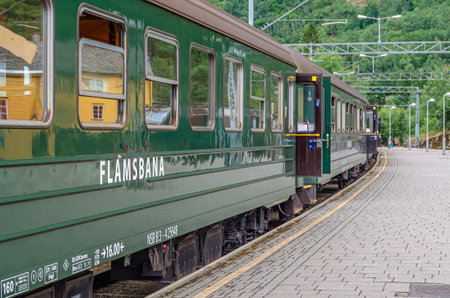 FLAM, NORWAY - JULY 16, 2014: Train at Flam station, belonging to Flam Line (Flamsbana), a railway line between Myrdal and Flam in Norway, one of the most visited tourist attractions in Norwayのeditorial素材