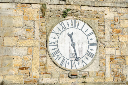 Detail of the Clock Tower in Llastres, Asturias, Spain, built in the 15th century; in 1751 the building was remodeled and the clock was addedの写真素材