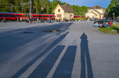 NESBYEN, NORWAY - JULY 17, 2014: People evacuated from the train on the Bergen-Oslo route, while waiting for a breakdown to be fixed, at the train station in the village of Nesbyen, Norwayのeditorial素材