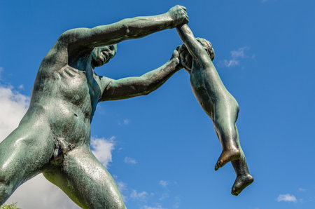OSLO, NORWAY - JULY 18, 2014: Vigeland installation of sculptures created by sculptorÂ Gustav Vigeland from the 1920s until his death (1943) in Frogner Park,Â Oslo,Â Norway. It consists of sculptures as well as larger structures such as bridges and fountaのeditorial素材
