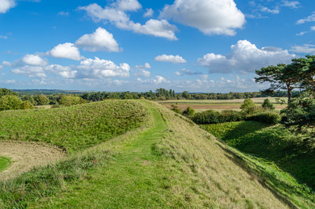 CASTLE RISING, UNITED KINGDOM - OCTOBER 10, 2014: View of the surroundings and earthworks of Castle Rising Castle, a ruined medieval fortification in the village of Castle Rising, Norfolk, England, built in 1138のeditorial素材
