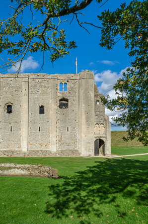 CASTLE RISING, UNITED KINGDOM - OCTOBER 10, 2014: Exterior view of Castle Rising Castle, a ruined...