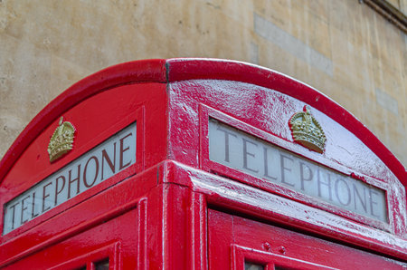 CAMBRIDGE, UNITED KINGDOM - OCTOBER 11, 2014: Typical English red telephone booth in the city of...