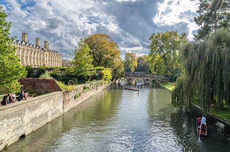 CAMBRIDGE, UK - OCTOBER 11, 2014: Punting on the River Cam in Cambridge, England. A punt is a...