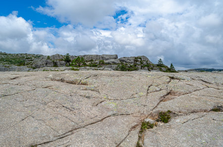 View of rock formations on the route to Preikestolen (The Pulpit Rock), a tourist attraction in Rogaland county, Norway, a steep cliff which rises 604 metres above Lysefjordenの写真素材