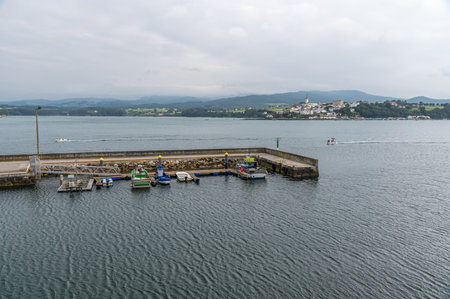 RIBADEO, SPAIN - AUGUST 30, 2022: View of the port of Ribadeo (Galicia), with the town of Castropol...