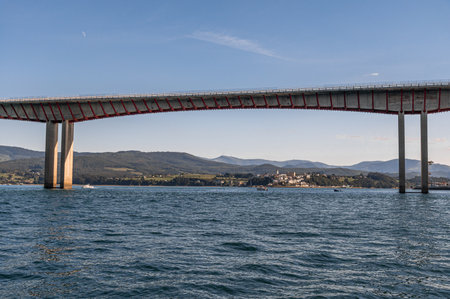 View of the Bridge of the Saints (Puente de los Santos) which connects Asturias with Galicia over the Eo estuary, northern Spainの写真素材