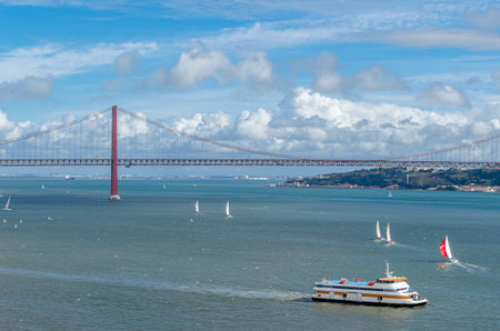 LISBON, PORTUGAL - NOVEMBER 8, 2014: Aerial view of the Tagus River from the top of the Monument of the Discoveries, with the 25 de Abril Bridge in the background in Lisbon, Portugalのeditorial素材
