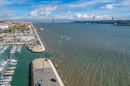 LISBON, PORTUGAL - NOVEMBER 8, 2014: Aerial view of the Tagus River from the top of the Monument of the Discoveries, with the 25 de Abril Bridge in the background in Lisbon, Portugalのeditorial素材
