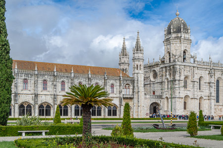 LISBON, PORTUGAL - NOVEMBER 8, 2014: Tourists in the front of the Jeronimos Monastery, example of the late Portuguese Gothic Manueline style of architecture in Lisbon, Portugalのeditorial素材
