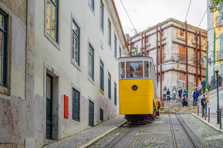 LISBON, PORTUGAL - NOVEMBER 7, 2014: The Gloria Funicular (Ascensor da Gloria), a funicular railway line in Lisbon, Portugal. It connects Restauradores Square with the Bairro Alto, operated by Carrisのeditorial素材