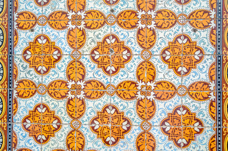 Architectural detail, colorful ceramic tiles covering building facades in the old town of Lisbon,...