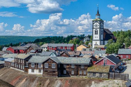 View of the Roros Church from the mining district, with slag in the foreground, the mining town of Roros, Trondelag county, Norwayの写真素材