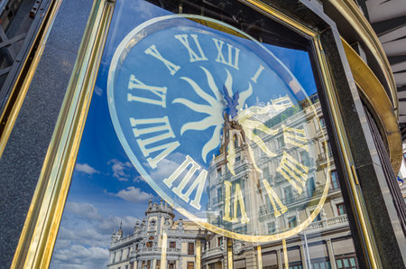 MADRID, SPAIN - APRIL 19, 2015: Clock in the window of the iconic Grassy Jewelry store located at the beginning of Gran Via street in Madrid, Spainのeditorial素材