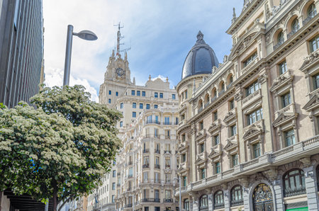 View of buildings on Gran Via in Madrid, Spain. The Gran Via serves as a showcase of early 20th-century revival architecture, with architectural styles ranging from Vienna Secession style, Plateresque, Neo-Mudejar and Art Deco, among othersのeditorial素材