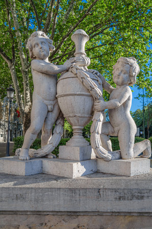 The Children with a Vase monument, located in the Plaza de Cibeles, Madrid, Spain. There are two theories about the origin of this sculptural group, attributed to the architect Isidro Gonzalez (1830, in other sources, 1770); it has also been attributed to the sculptor Felipe de Castroの写真素材