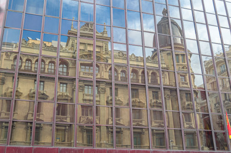 Reflection in a glass wall of historic buildings on Gran Via in Madrid, Spainのeditorial素材