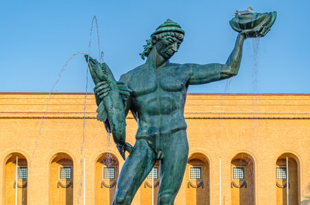 GOTHENBURG, SWEDEN - JULY 9, 2014: Statue of Poseidon (the sea God) by Carl Milles, inaugurated in 1931, in Gothenburg, Sweden, with the Gothenburg Museum of Art in the backgroundのeditorial素材